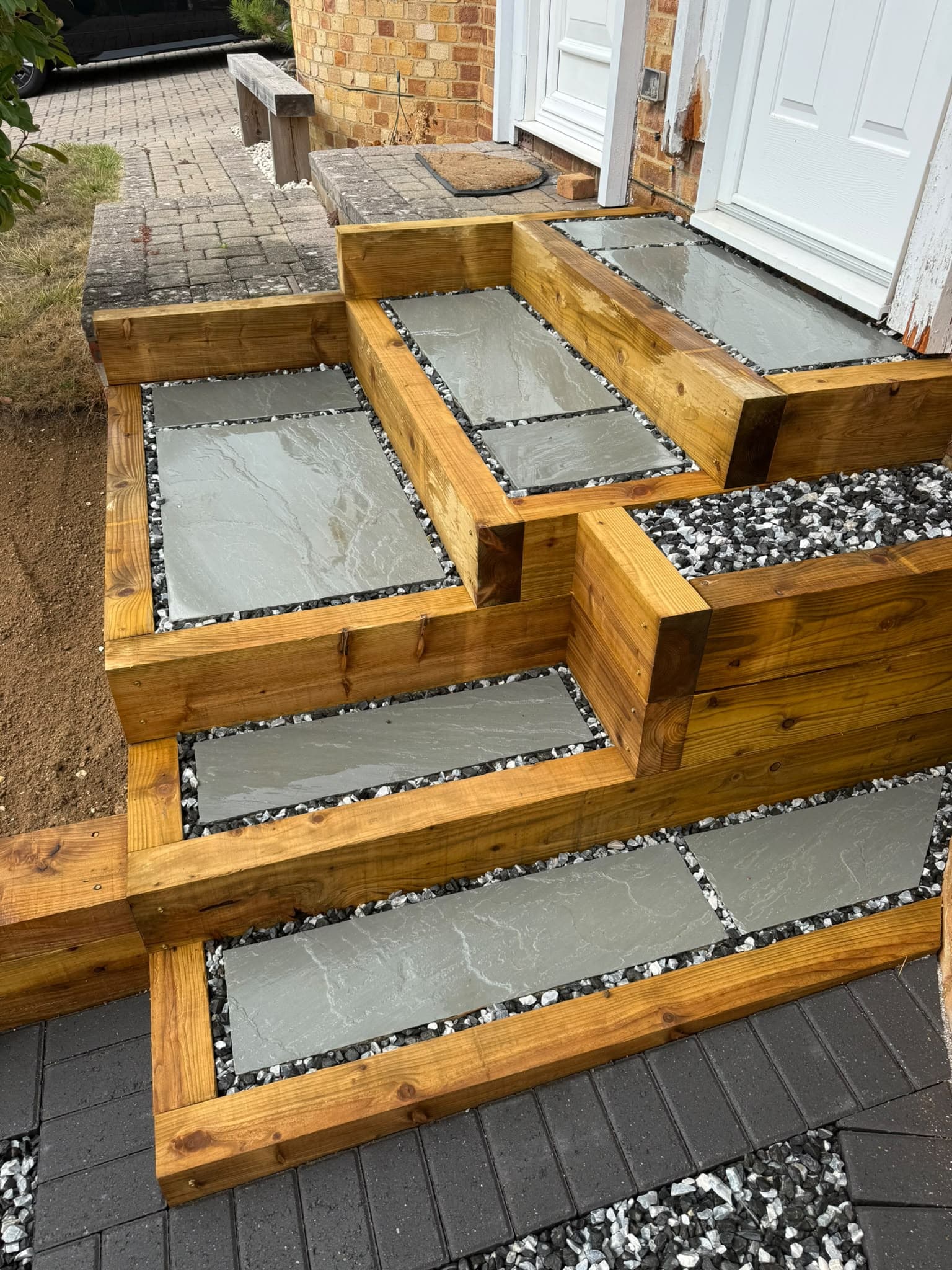 Timber sleeper steps with sandstone treads